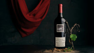 Bottle of Kraehe House Block Shiraz on a dark background